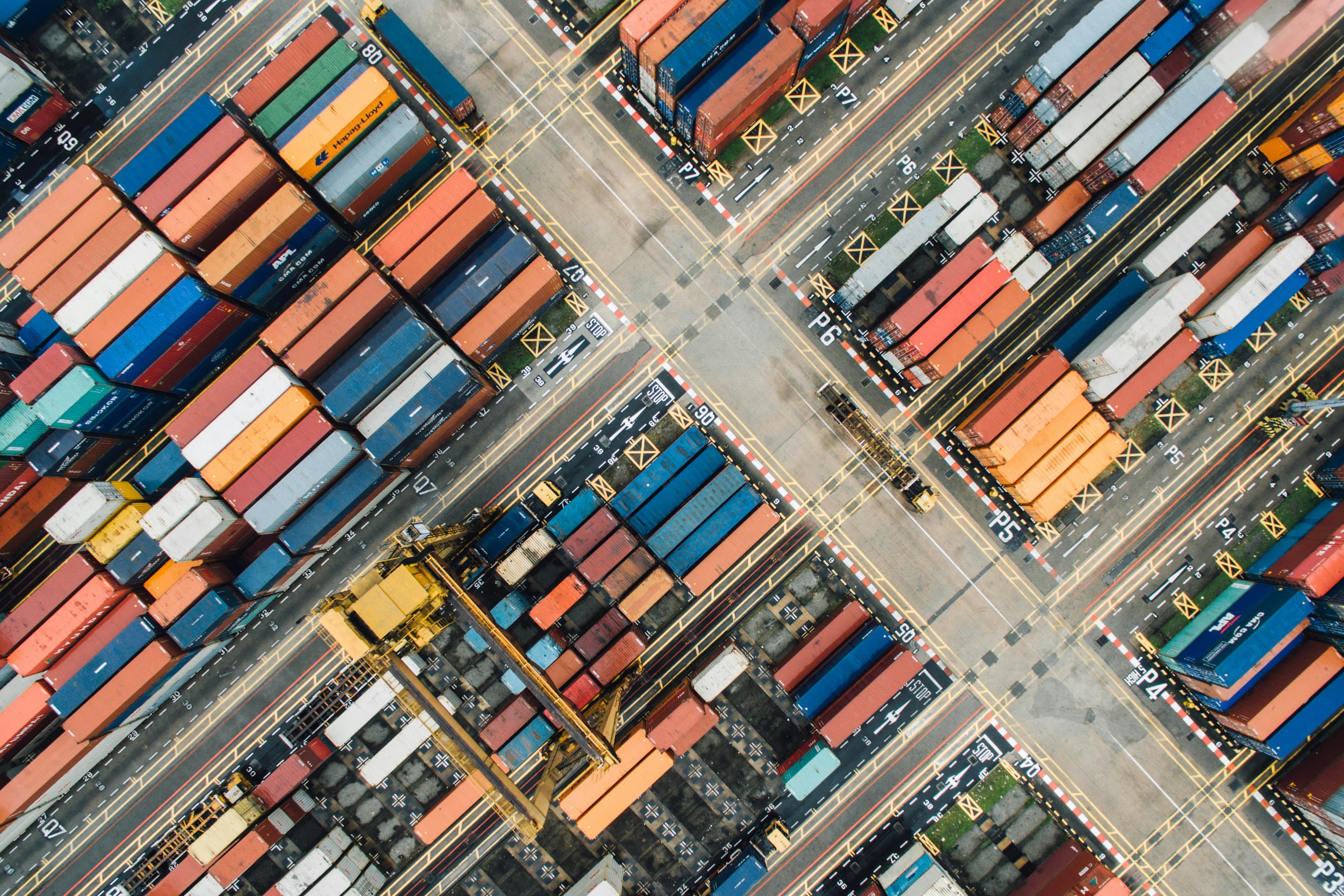 Aerial view of containers moving through an international port