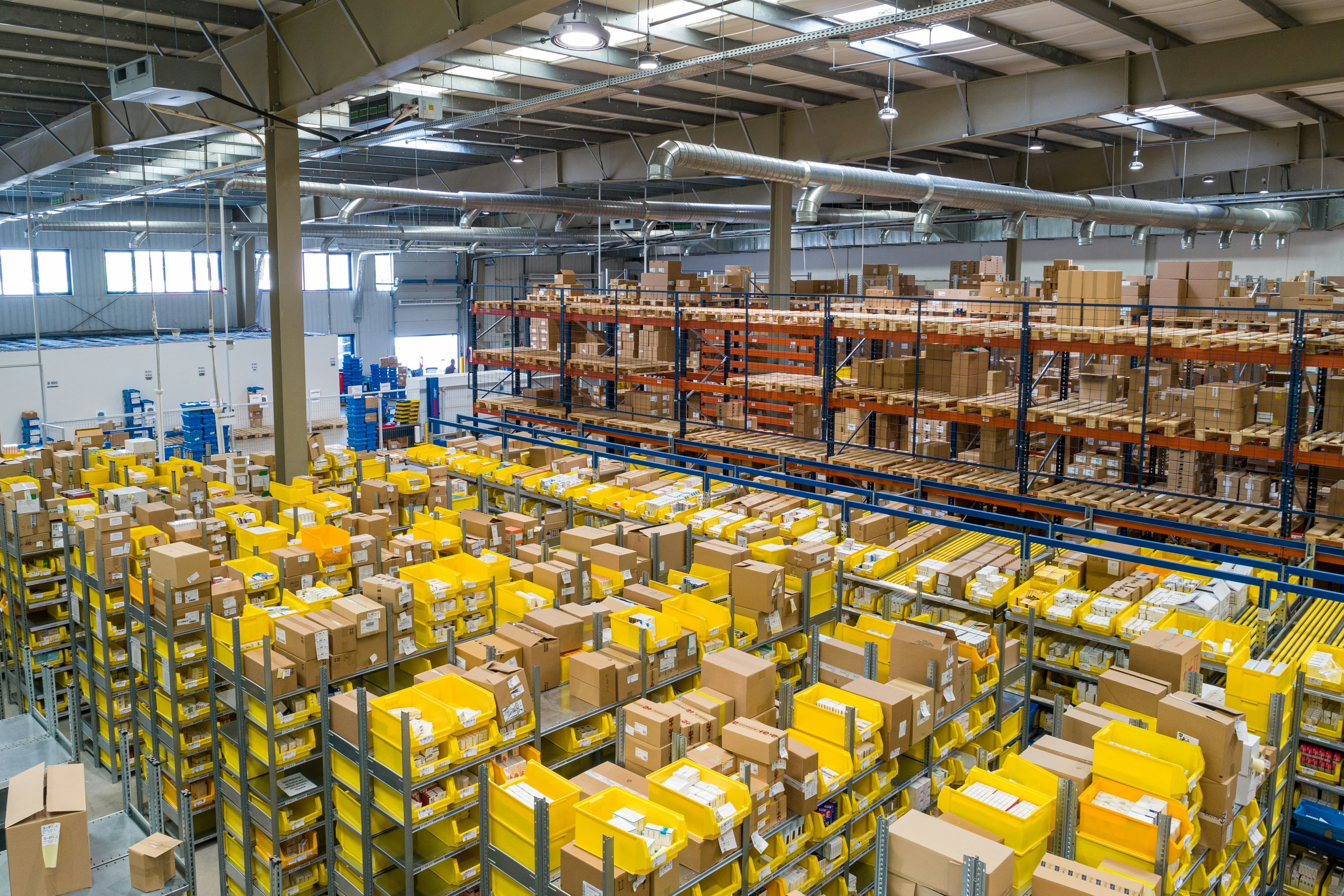 A logistics professional working inside a distribution warehouse
